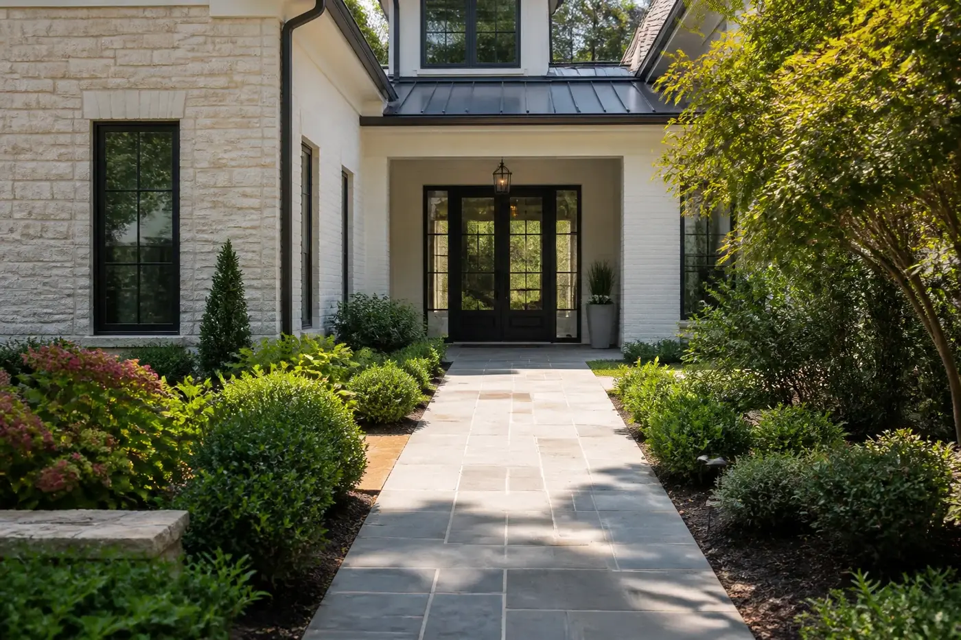 New Charlotte luxury custom home with a gently graded garden path meeting a sheltered zero-step front entry