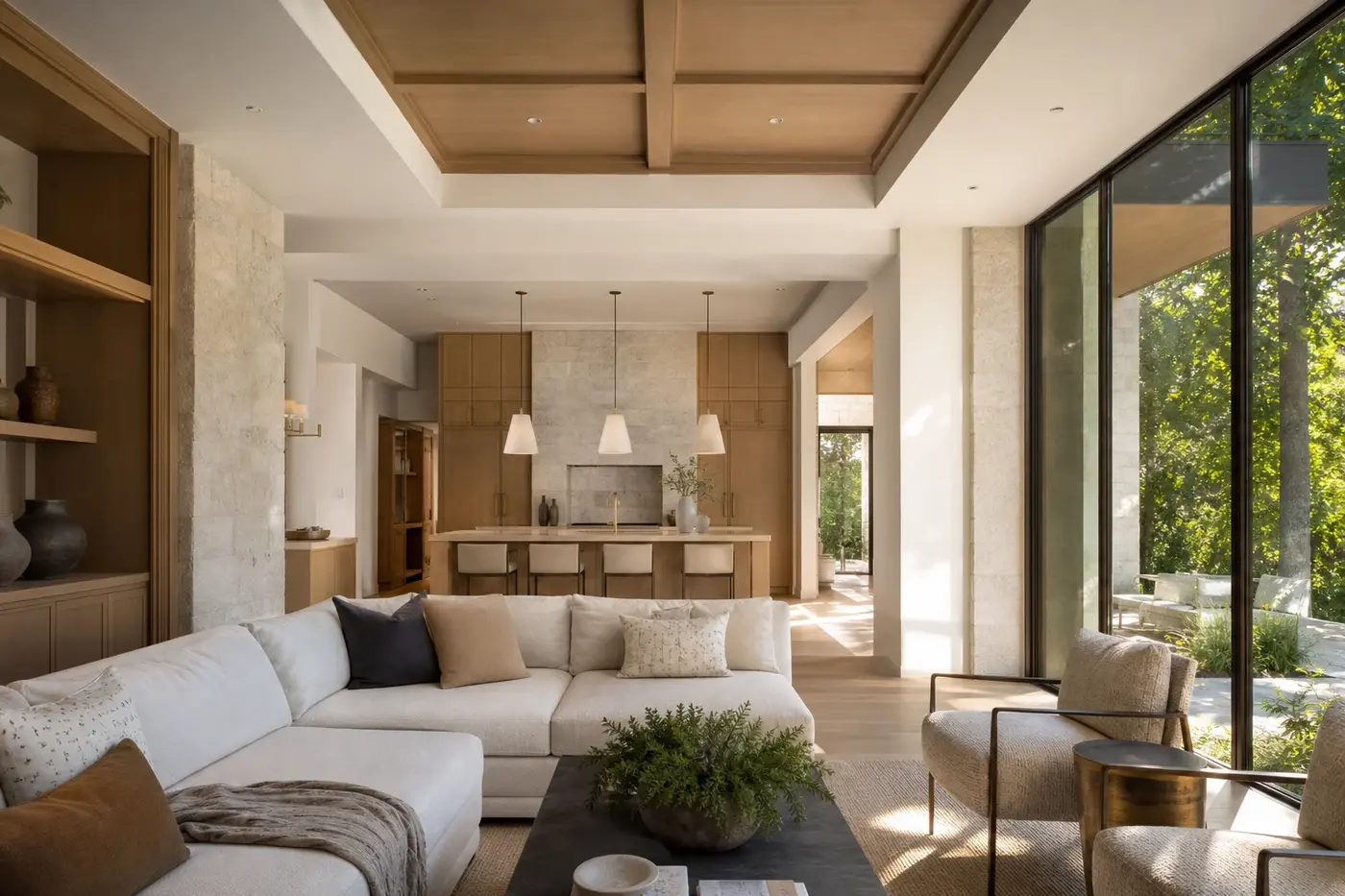 Luxury great room and white oak kitchen receiving controlled daylight through garden-facing bronze-framed windows