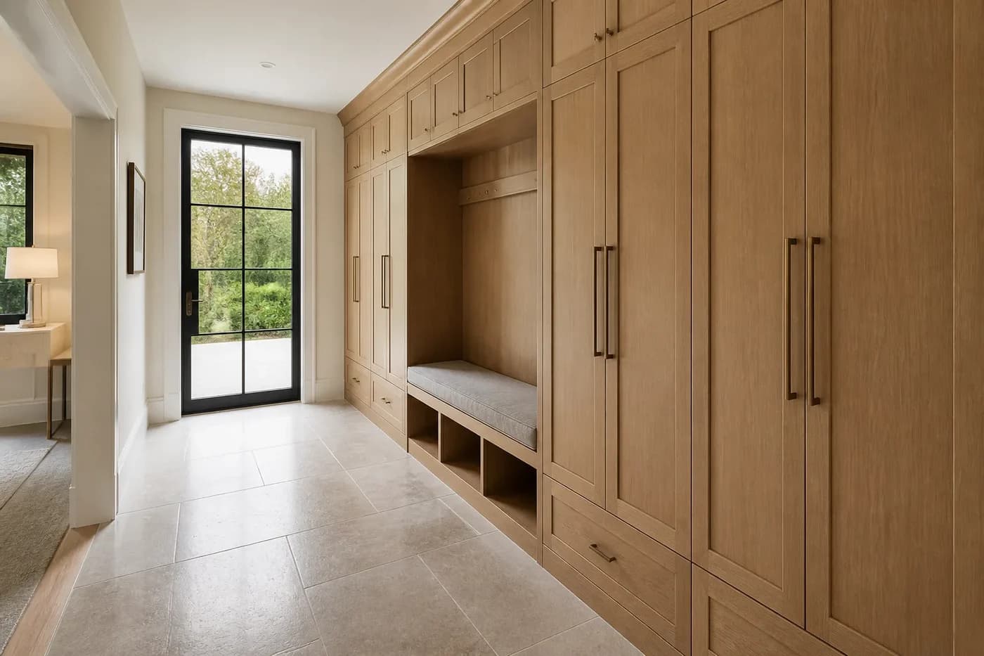 New Charlotte luxury custom home with a garden entry and full-height white oak storage built into the arrival hall