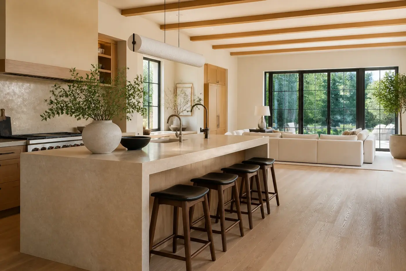 New Charlotte custom-home kitchen and great room with white oak cabinetry, stone island, and garden-facing windows